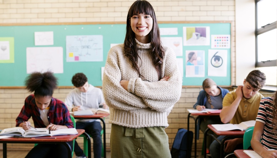 A happy teacher inside the classroom
